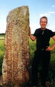 Sigvald next to 
a runestone.
